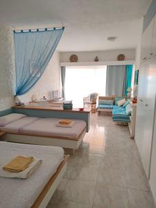 Postel nebo postele na pokoji v ubytování Front Beach Jandía Apartment