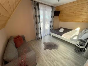 Łóżko lub łóżka w pokoju w obiekcie Domek Góralski Kąty na Wierchu