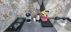 A kitchen or kitchenette at TAPIA'S ROOMS one