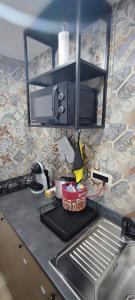 A kitchen or kitchenette at TAPIA'S ROOMS one