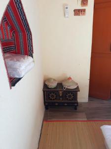 Een bed of bedden in een kamer bij Mahalli Balad Sayt Heritage Inn