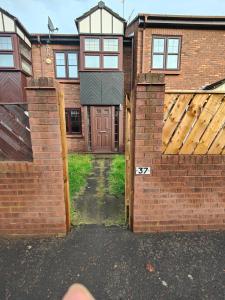 a person pointing at a brick building with two gates at Great place in Newcastle in Newcastle upon Tyne