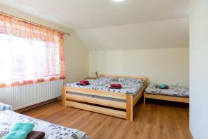 Posteľ alebo postele v izbe v ubytovaní Apartmány Petra