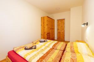 Posteľ alebo postele v izbe v ubytovaní Apartmány Petra