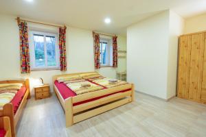 Posteľ alebo postele v izbe v ubytovaní Apartmány Petra