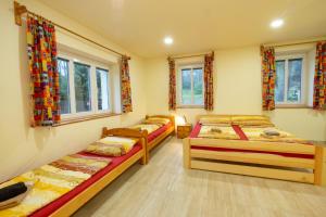Posteľ alebo postele v izbe v ubytovaní Apartmány Petra