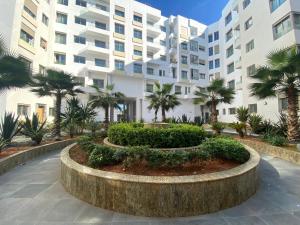 a large apartment building with a large building at CORNICHE CASABLANCA - SUBLIME F2 NEUF in Casablanca