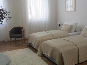 Postel nebo postele na pokoji v ubytování Hotel Wiener Kindl