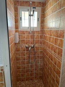 a bathroom with a shower with a shower head at Esencia de Arcos in Arcos de la Frontera +29 photos