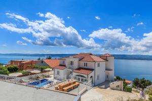 an image of a house with a view of the water at Villa Katarina in Stanići