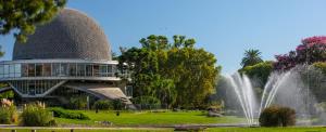 a building with a fountain in a park at palermo frente al Zoo in Buenos Aires