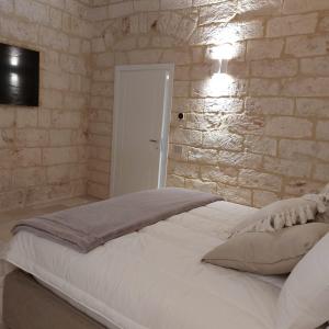 Postel nebo postele na pokoji v ubytování Palazzo Momi