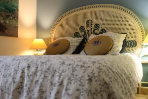 Łóżko lub łóżka w pokoju w obiekcie Les Chambres de Fanny