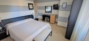 Postel nebo postele na pokoji v ubytování Hotel Le Focette