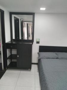 Postel nebo postele na pokoji v ubytování Hotel Murano Medellín