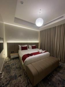 Postel nebo postele na pokoji v ubytování فندق جولدن نيو قريش - Golden New Quraish Jeddah-شركة الذهبية العصرية الفندقية + 18 fotografií