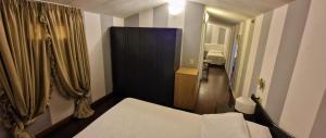 Postel nebo postele na pokoji v ubytování Hotel Le Focette