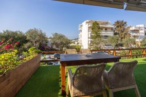 Balkón alebo terasa v ubytovaní Beachside Bungalows + 14 fotografií