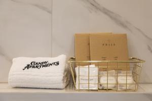 a basket of towels and a box on a shelf at Candy Ballerina No 2 Zagreb Center - top positon Lux in Zagreb