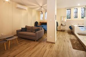 a living room with a couch and a bedroom at Appartement Loft Detente in Strasbourg +24 photos