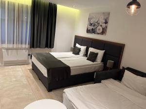 Voodi või voodid majutusasutuse Apart Hotel & spa Zoned II, Kopaonik, apartman Lukač - special benifit Children up to 13 of age accompanied by two adutls staj for free! FREE PARKING! toas +29 fotot