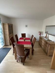 a dining room with a table and chairs at Oase der Ruhe 2 in Waldsieversdorf