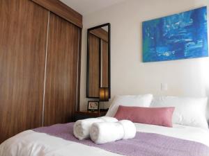 Katil atau katil-katil dalam bilik di Cozy depa equipado ideal Aeropuerto, Foro Sol