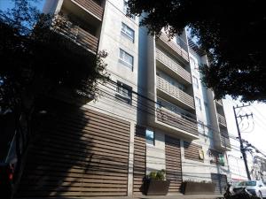 a building with large wooden slats on the side of it at Cozy depa equipado ideal Aeropuerto, Foro Sol in Mexico City