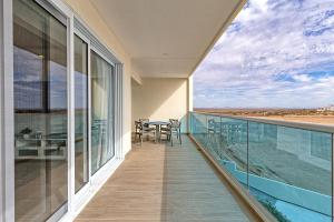 A balcony or terrace at Brand New Contemporary 2 BD Oceanfront Condo at Encantame Towers Verano E302