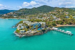 an aerial view of a resort on a island in the water at Coral Sea Marina Resort in Airlie Beach