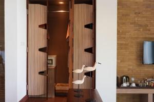 a room with two white chairs on a table at Panviman Resort Koh Phangan - SHA Extra Plus in Thong Nai Pan Noi