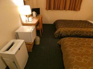 Voodi või voodid majutusasutuse Hotel Tsuchiya toas