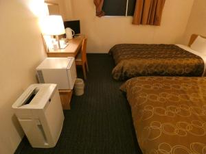 Voodi või voodid majutusasutuse Hotel Tsuchiya toas