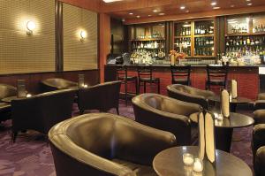 a restaurant with leather chairs and a bar at Millennium Hotel Broadway Times Square in New York