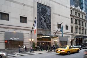 a yellow taxi cab parked in front of a building at Millennium Hotel Broadway Times Square in New York