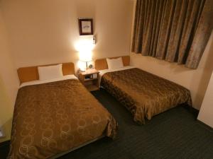 Voodi või voodid majutusasutuse Hotel Tsuchiya toas