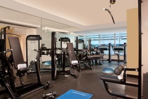 a gym with a lot of tread machines and a mirror at Millennium Hotel Broadway Times Square in New York