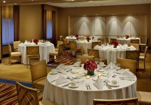 a banquet room with white tables and chairs at Millennium Hotel Broadway Times Square in New York