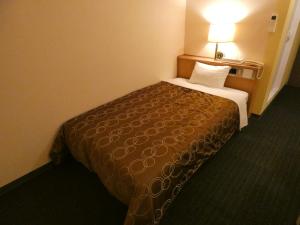 Voodi või voodid majutusasutuse Hotel Tsuchiya toas
