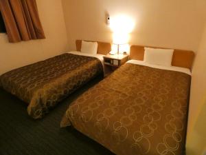 Voodi või voodid majutusasutuse Hotel Tsuchiya toas