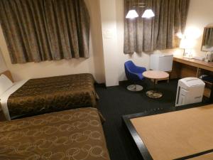Voodi või voodid majutusasutuse Hotel Tsuchiya toas