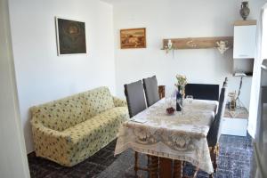 a dining room with a table and a chair at Apartment in Slatine with Terrace, Air conditioning, WIFI, Washing machine (4784-3) in Slatine