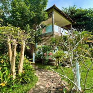 a house with a walkway in front of it at Kep Lodge in Kep