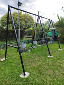 a group of swings in a park at Bed and Breakfast Little Italy in Boquerón