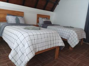 Postel nebo postele na pokoji v ubytování Villa HOMEY Lombok