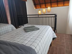 Postel nebo postele na pokoji v ubytování Villa HOMEY Lombok