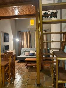 a room with a bunk bed and a table and chairs at GINEBRA SKY in Sierra Nevada