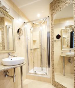 a bathroom with a shower and a sink at Hotel Atrium in Nowy Tomyśl