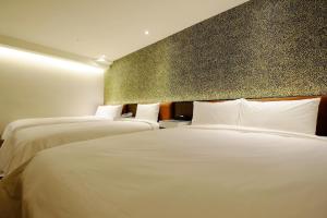 Letto o letti in una camera di Hotel Puri Taipei Station Branch