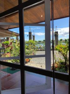 a window view of the city from a building at Villa Situ Citiwu Ciwidey in Ciwidey